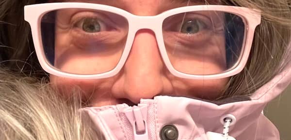 Blair in pink hooded parka that is also zipped up to his nose, and while we see a bit of his blonde hair and eyes, mostly we focus on the large pink glasses.