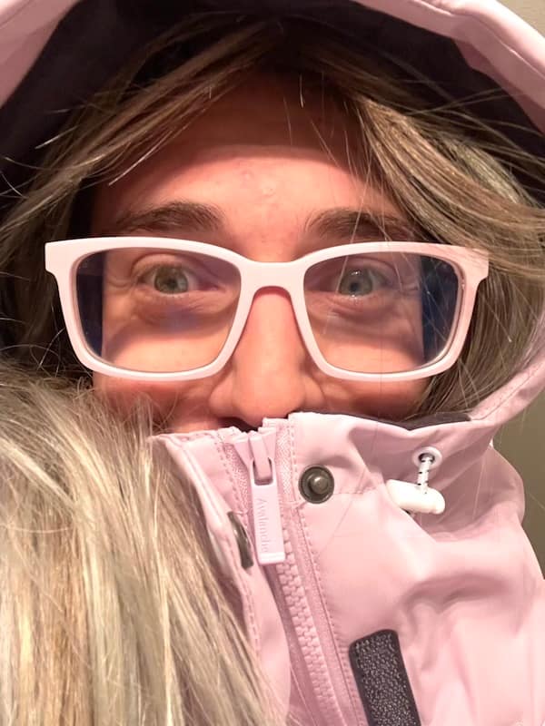 Blair in pink hooded parka that is also zipped up to his nose, and while we see a bit of his blonde hair and eyes, mostly we focus on the large pink glasses.